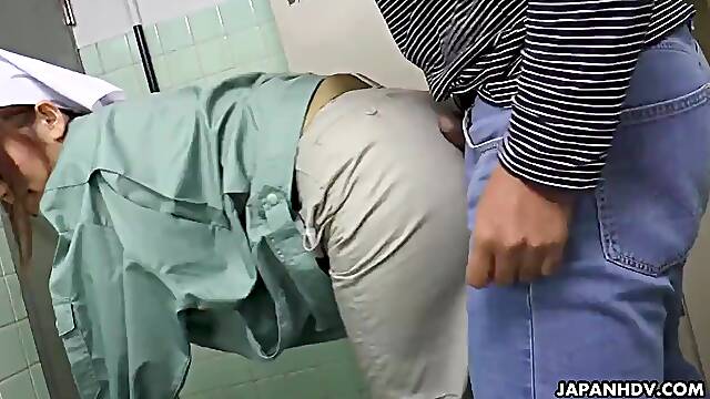 Slutty Asian cleaner blows a guy in the public toilet
