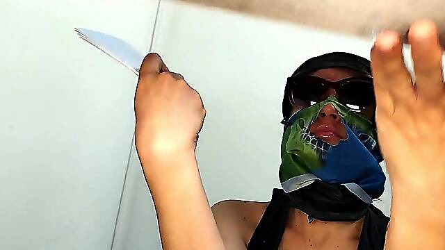 Luxurious naked lady prepares food in the kitchen.