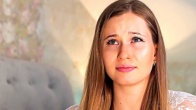 A beauty in a white robe masturbates with a vibrator